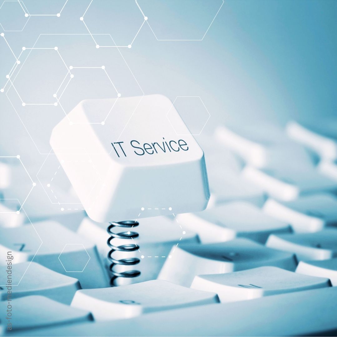 Taste aus Computertastatur mit IT-Service beschriftet