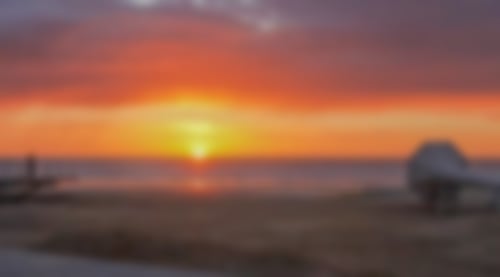 Strand und Meer bei Sonnenuntergang